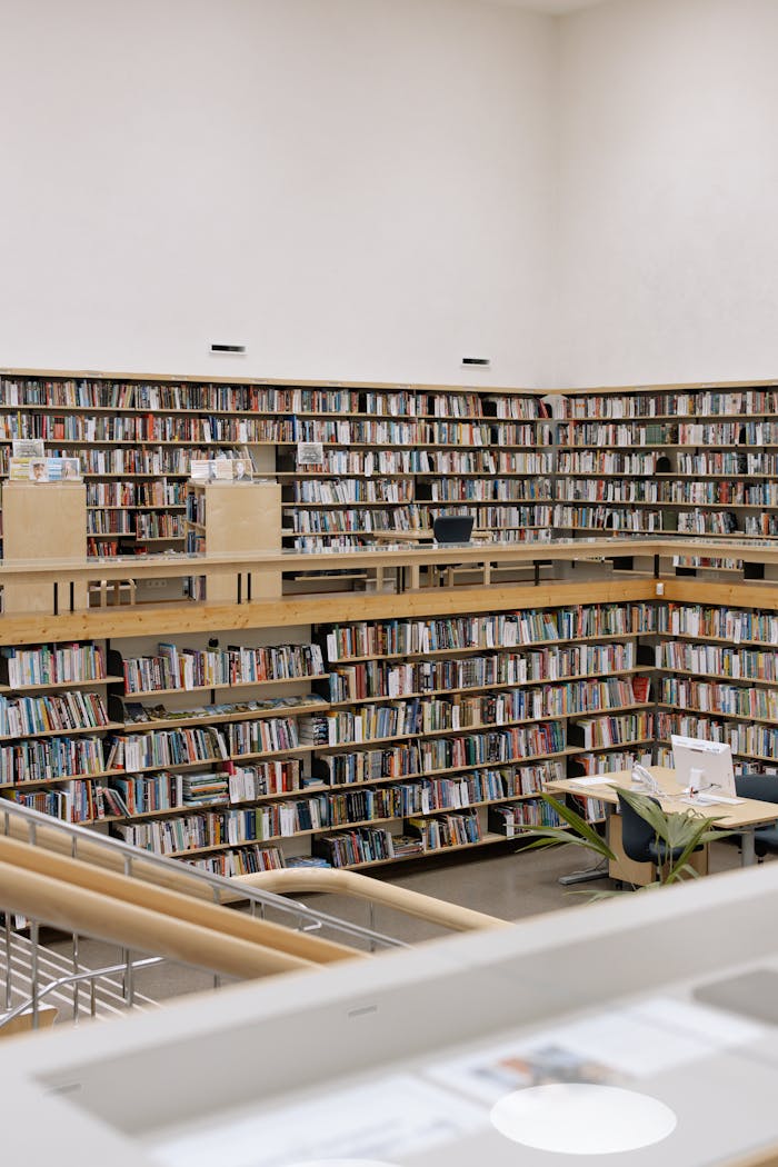 Spacious public library interior with extensive book collection.